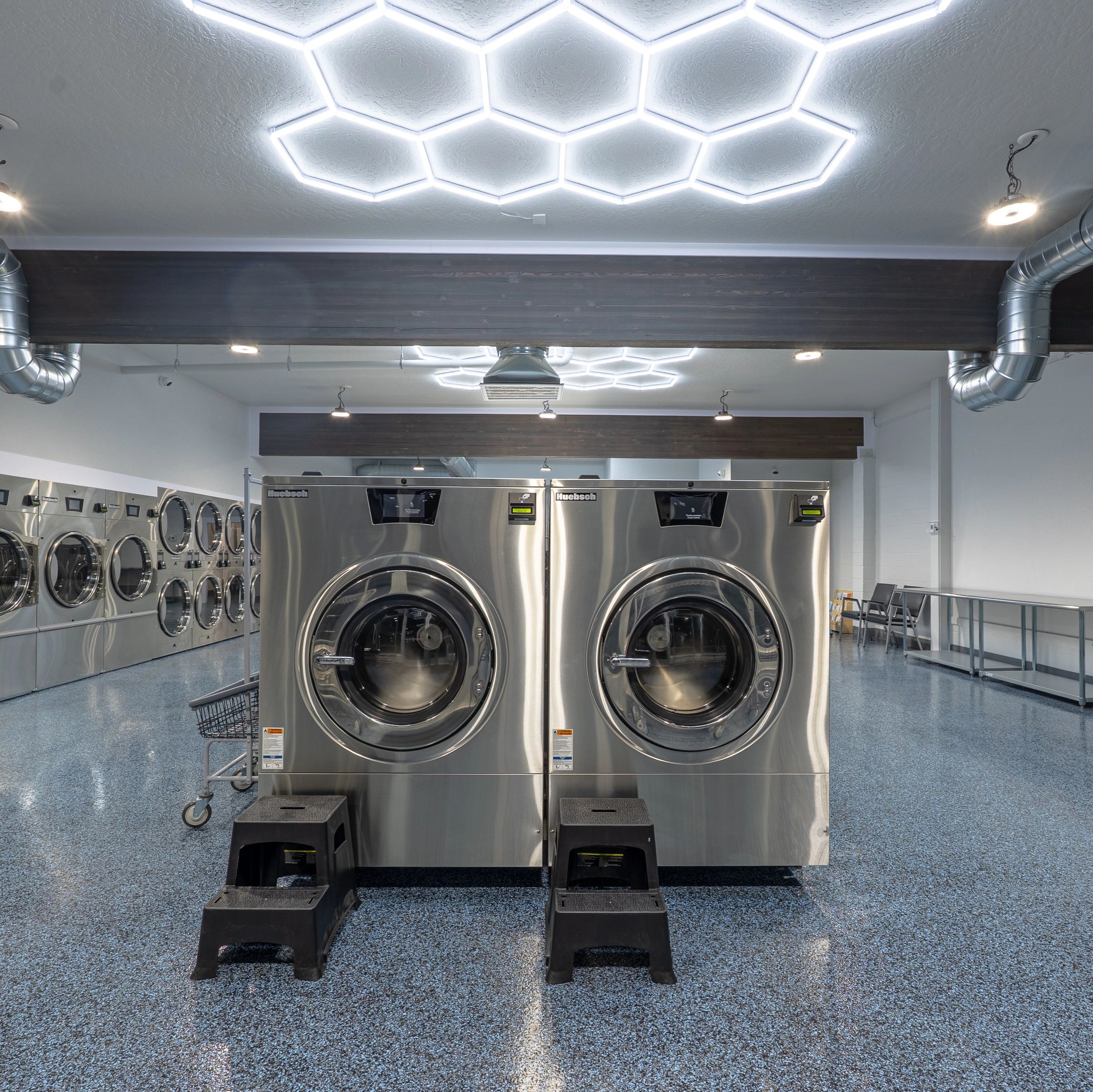 Inside 123 Laundry — Spokane Valley — modern stainless commercial laundry machines